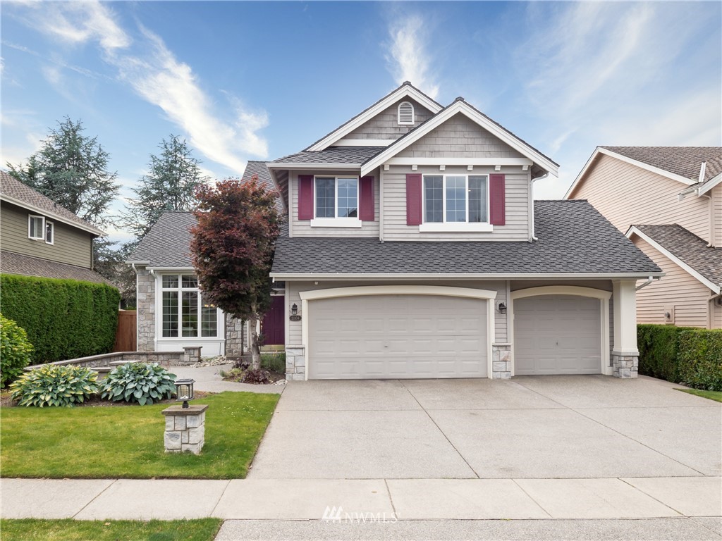 20104 27th Avenue Southeast Bothell, WA 98012 - Photo 27 of 27 a front view of a house with a yard and garage