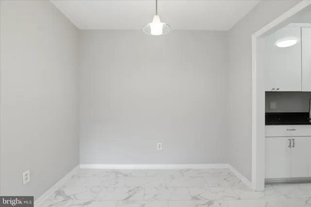 a view of an empty room with a flat screen tv