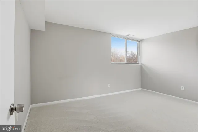 a view of an empty room and window