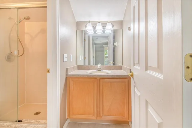 a bedroom with a bed lamp and a window