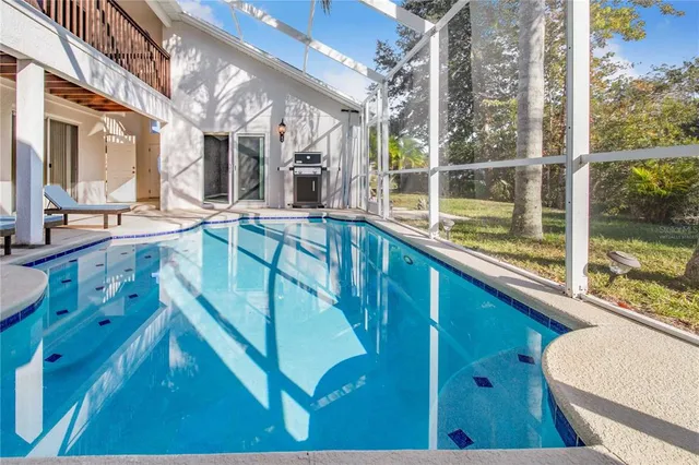 a view of swimming pool with seating area