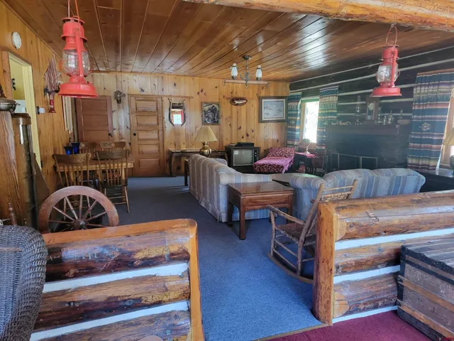a view of a livingroom with furniture and windows