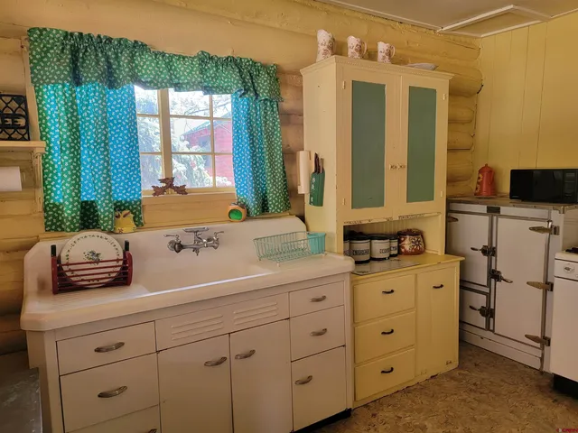 a view of kitchen and sink
