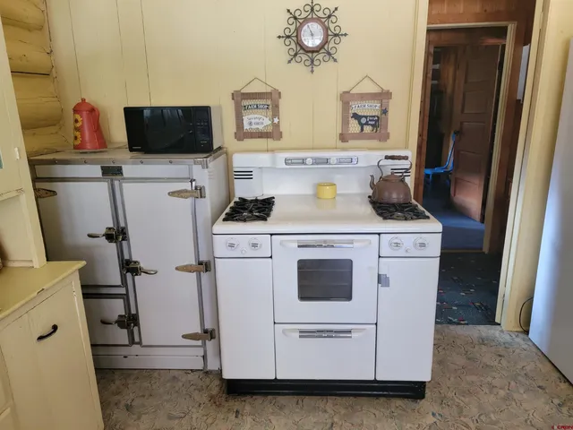 a bathroom with a sink and mirror with toilet