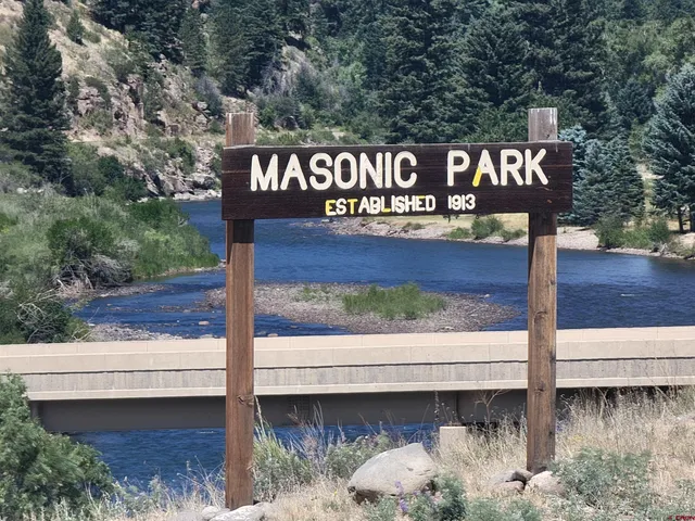 a view of a street with a yard