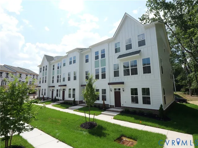a city view with tall buildings and a yard