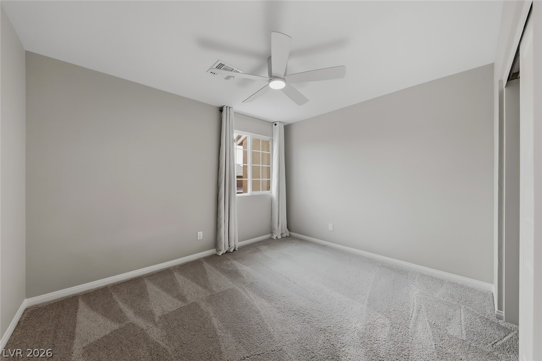 3564 Credere Lane Henderson, NV 89074 - Photo 27 of 40 Spare room featuring light colored carpet and a ceiling fan