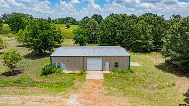 a house view with a garden space