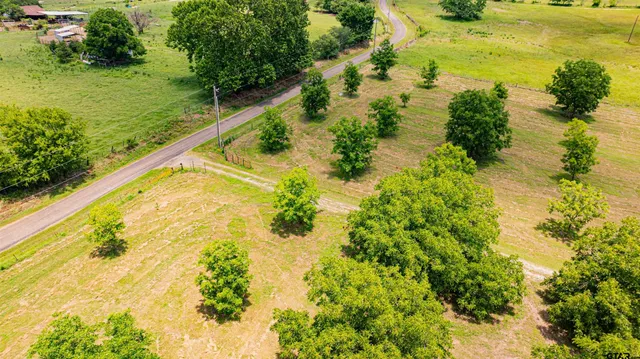 an aerial view of residential house with outdoor space and swimming pool