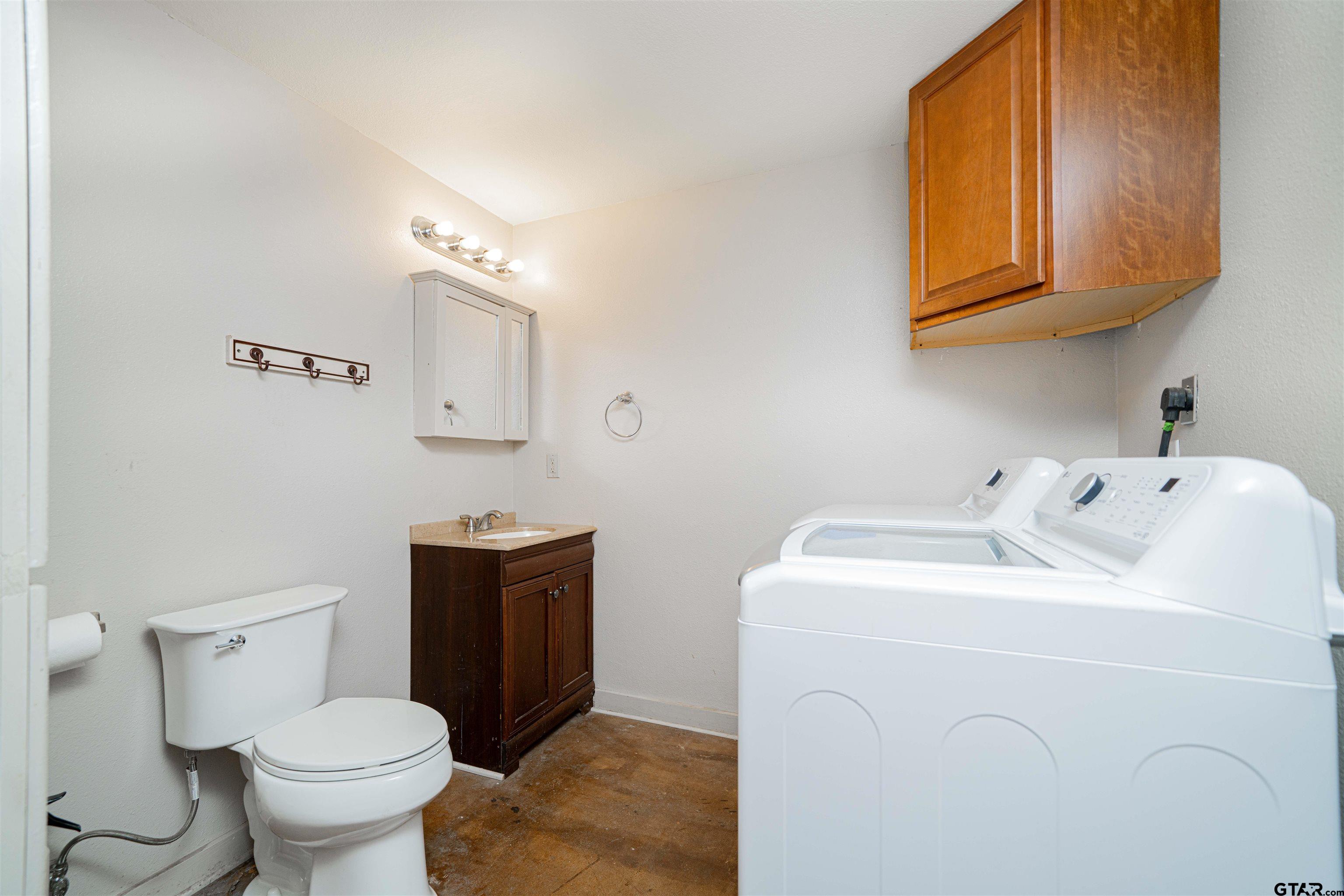 4510 Cr 2010 Mount Mount Vernon, TX 75457 - Photo 9 of 44 a bathroom with a toilet sink and mirror