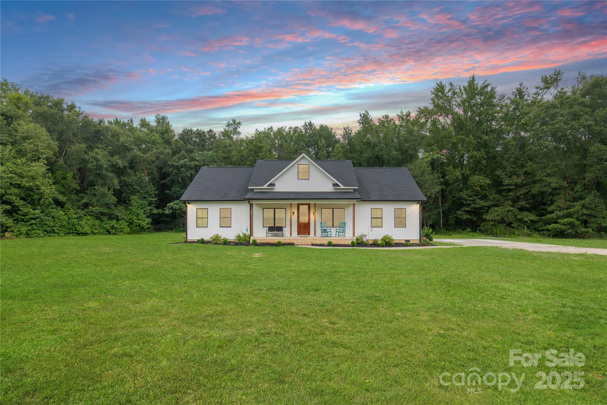 a view of a house with a big yard