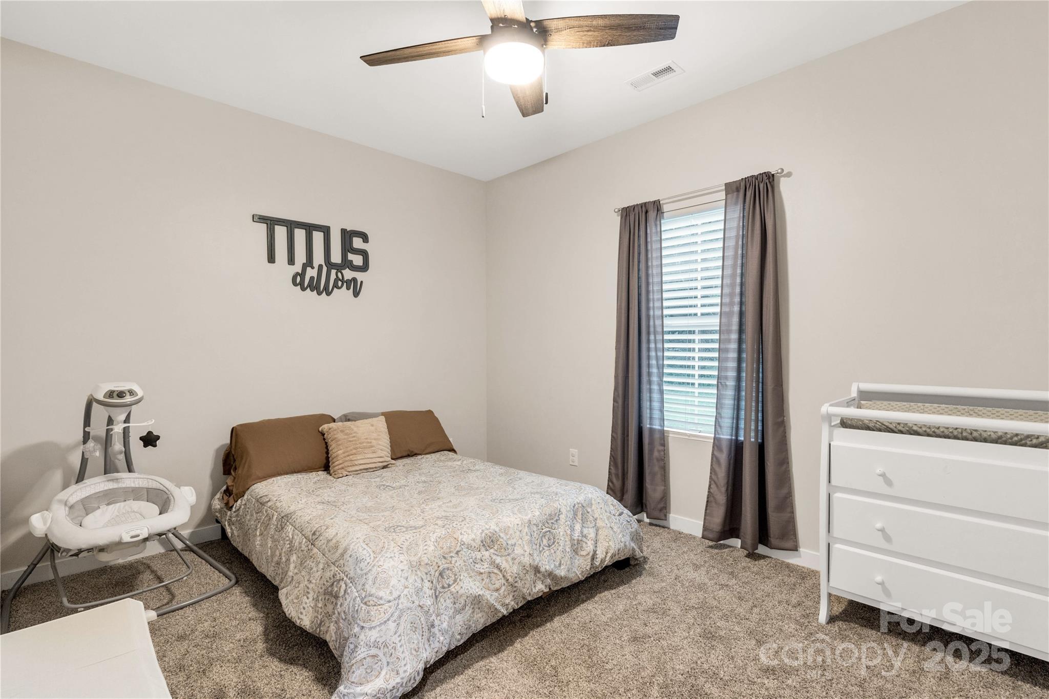 1964 Conservancy Road Kershaw, SC 29067 - Photo 15 of 26 a bedroom with a bed and a chandelier