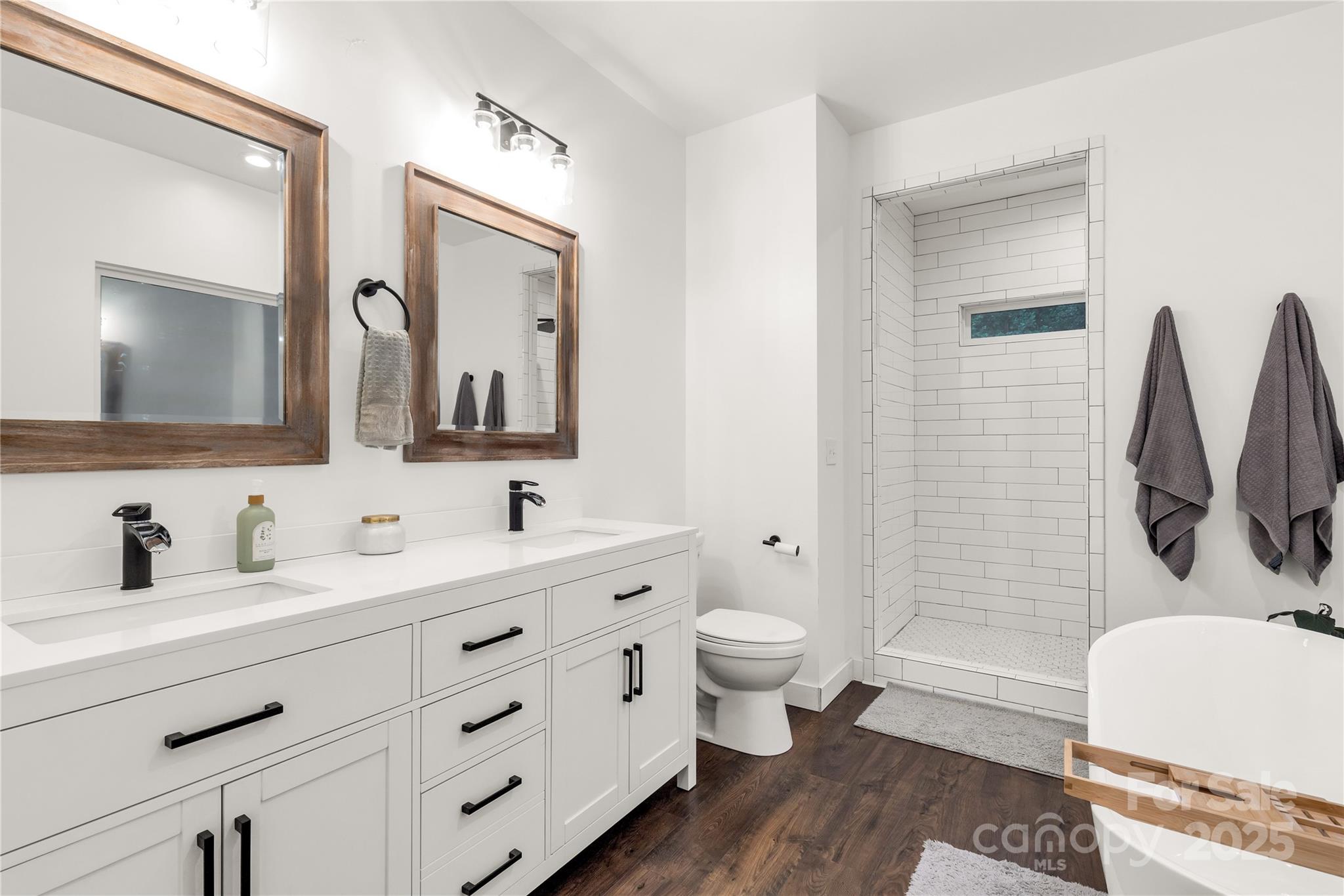 1964 Conservancy Road Kershaw, SC 29067 - Photo 19 of 26 a bathroom with a toilet a sink a tub and mirror