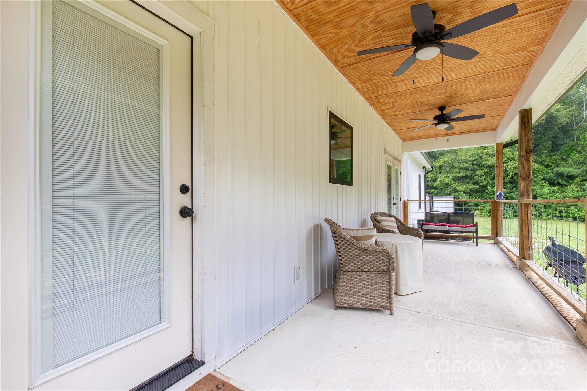 1964 Conservancy Road Kershaw, SC 29067 - Photo 21 of 26 a living room with furniture and a floor to ceiling window