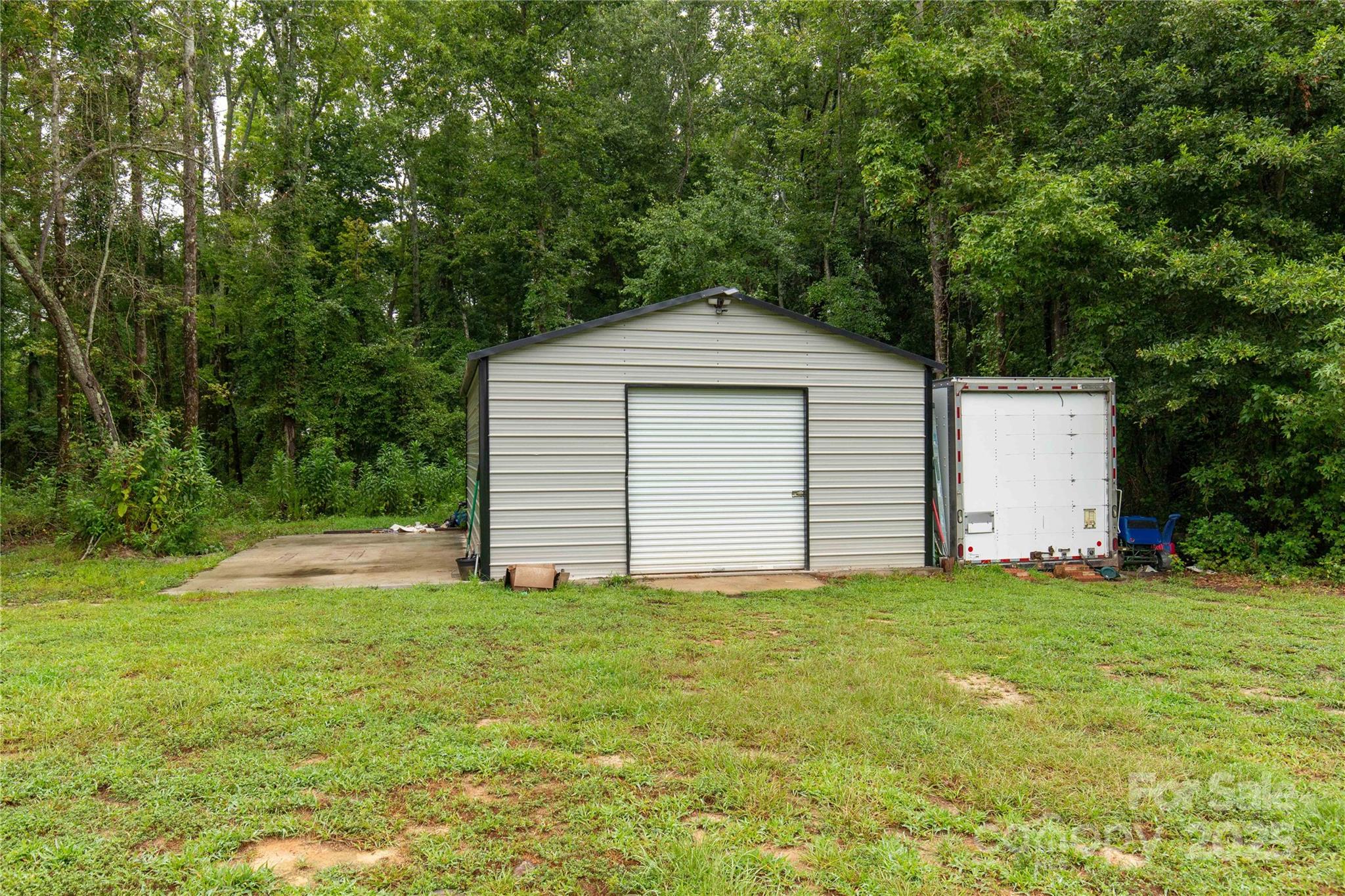 1964 Conservancy Road Kershaw, SC 29067 - Photo 23 of 26 a front view of a house with a yard
