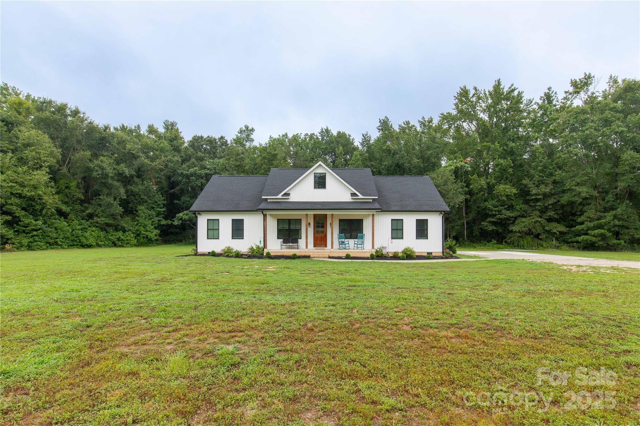 1964 Conservancy Road Kershaw, SC 29067 - Photo 3 of 26 a front view of a house with a garden