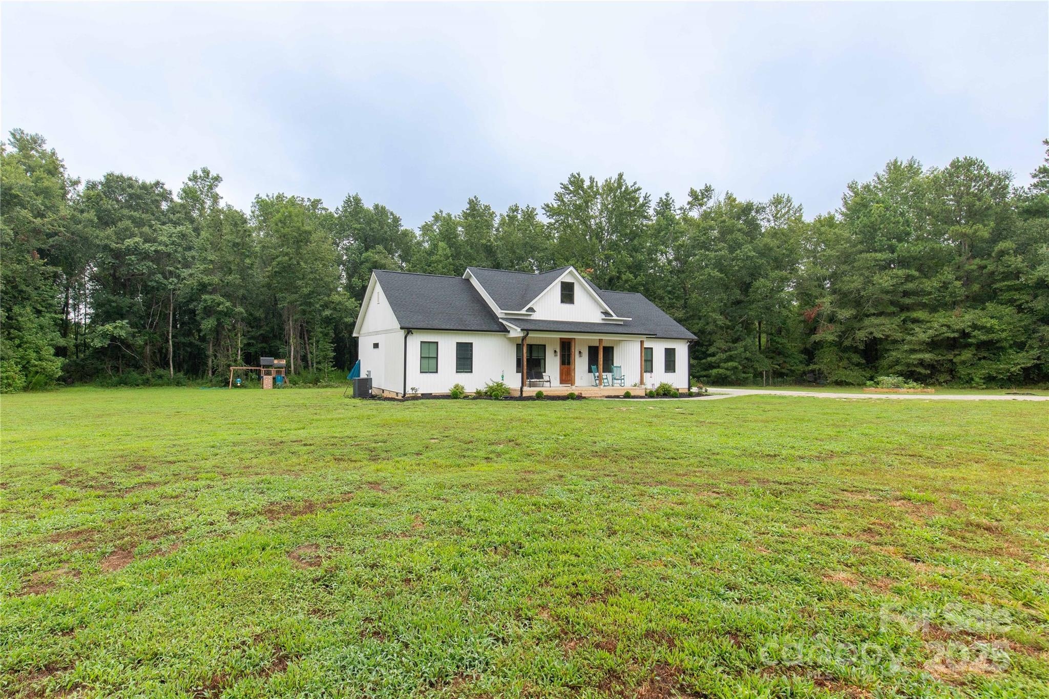 1964 Conservancy Road Kershaw, SC 29067 - Photo 4 of 26 a front view of a house with garden