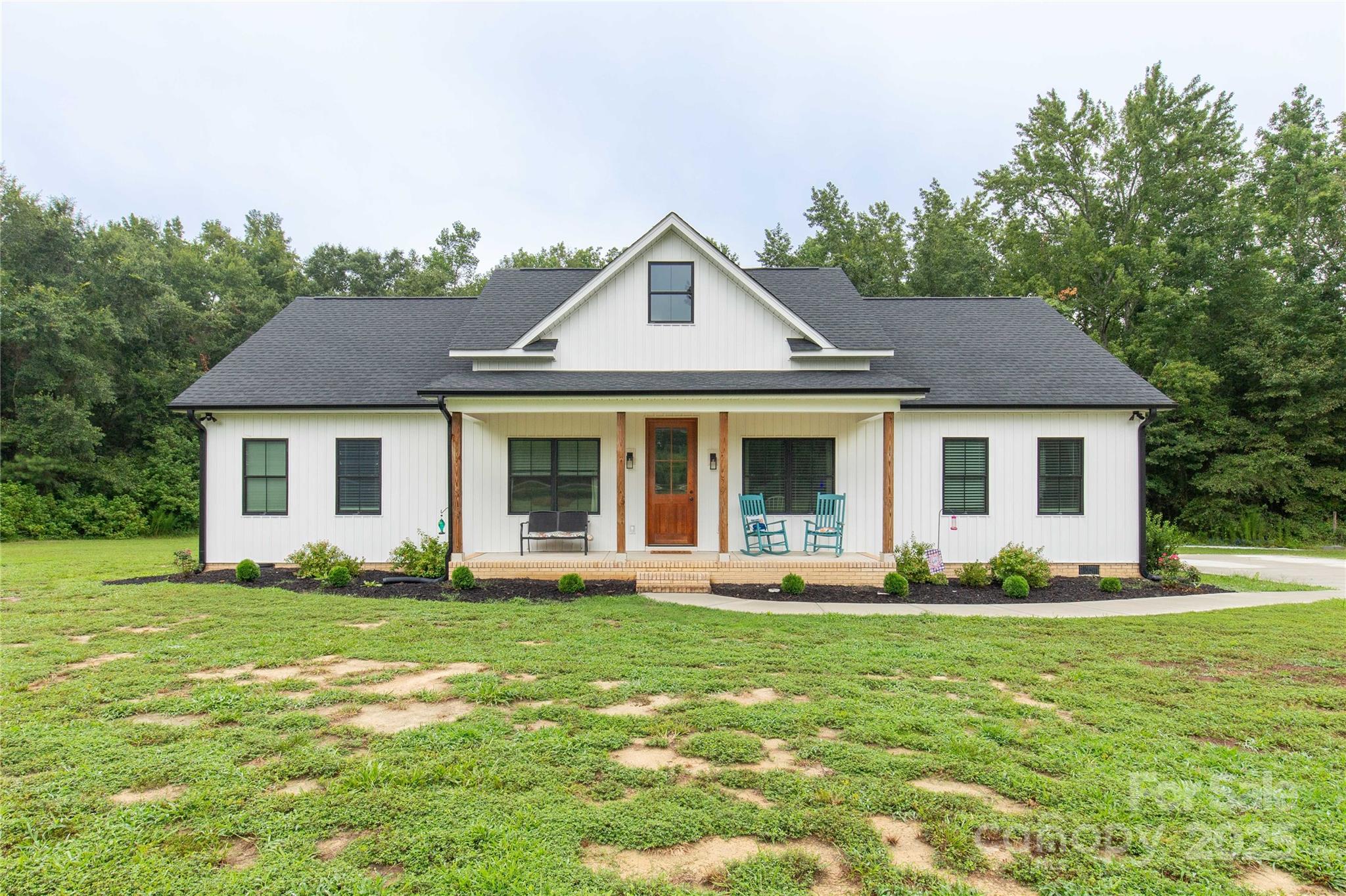 1964 Conservancy Road Kershaw, SC 29067 - Photo 5 of 26 a front view of a house with a yard and trees