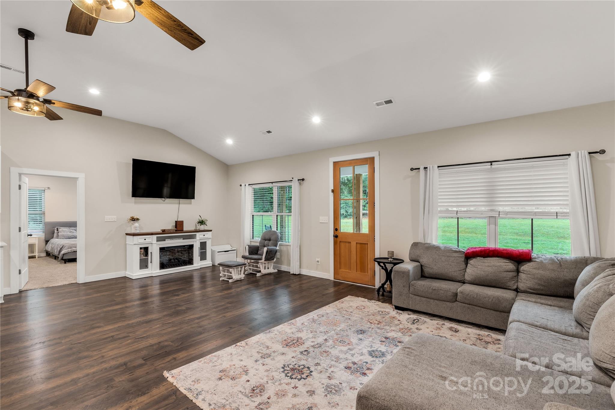 1964 Conservancy Road Kershaw, SC 29067 - Photo 10 of 26 a living room with furniture a flat screen tv and a fireplace
