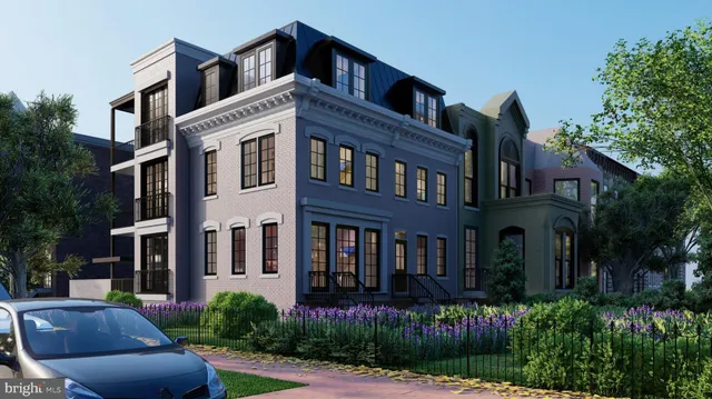 a front view of a house with yard and green space