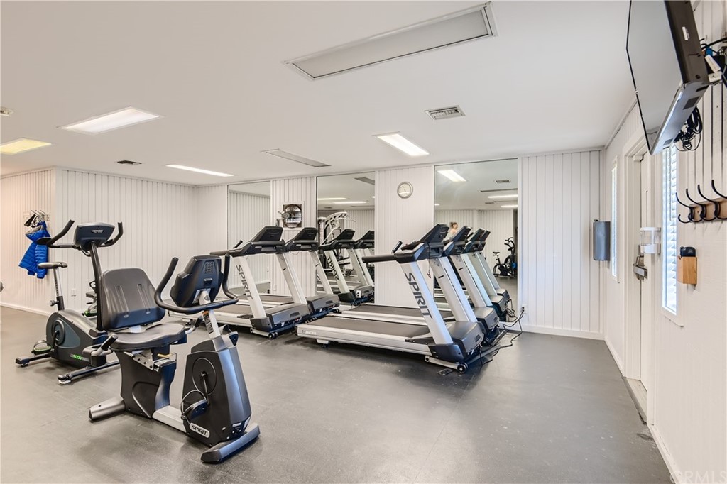 207 Orange Blossom, Unit 23 Irvine, CA 92618 - Photo 18 of 28 a view of a room with gym equipment