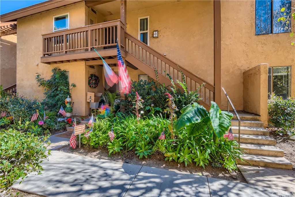 207 Orange Blossom, Unit 23 Irvine, CA 92618 - Photo 23 of 28 a view of entryway with flower pots