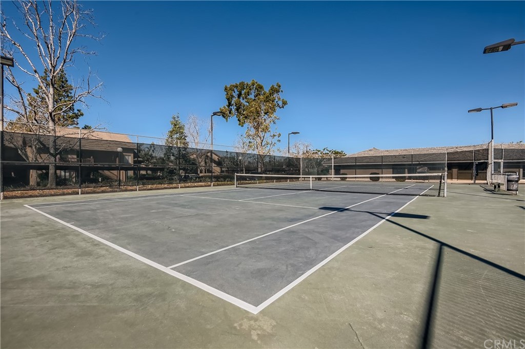 207 Orange Blossom, Unit 23 Irvine, CA 92618 - Photo 26 of 28 a view of a tennis court