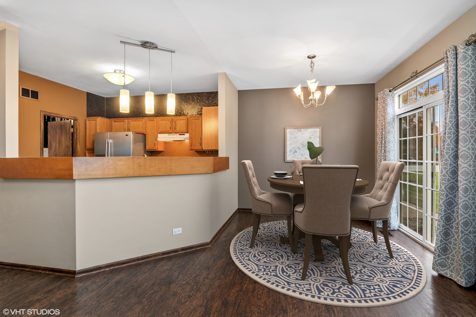 611 North Red Deer Road, Unit 433402 Round Lake, IL 60073 - Photo 4 of 15 a view of a dining room with furniture window and wooden floor