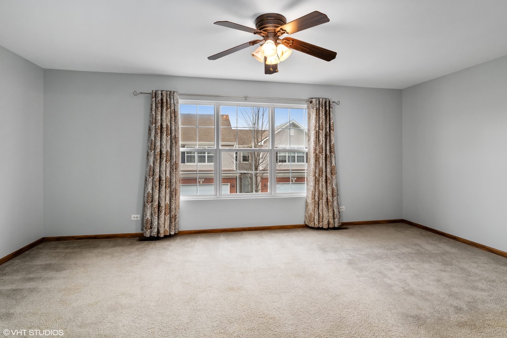 611 North Red Deer Road, Unit 433402 Round Lake, IL 60073 - Photo 8 of 15 a view of an empty room with a window