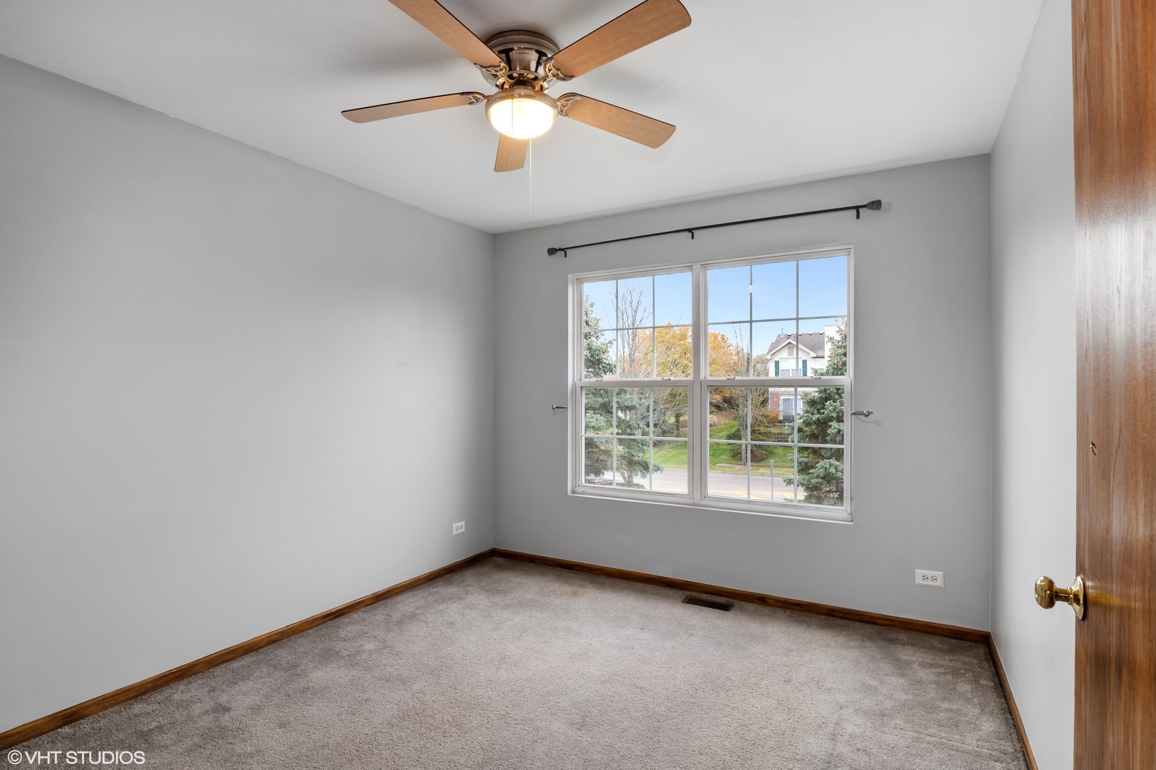 611 North Red Deer Road, Unit 433402 Round Lake, IL 60073 - Photo 10 of 15 an empty room with a window and a fan