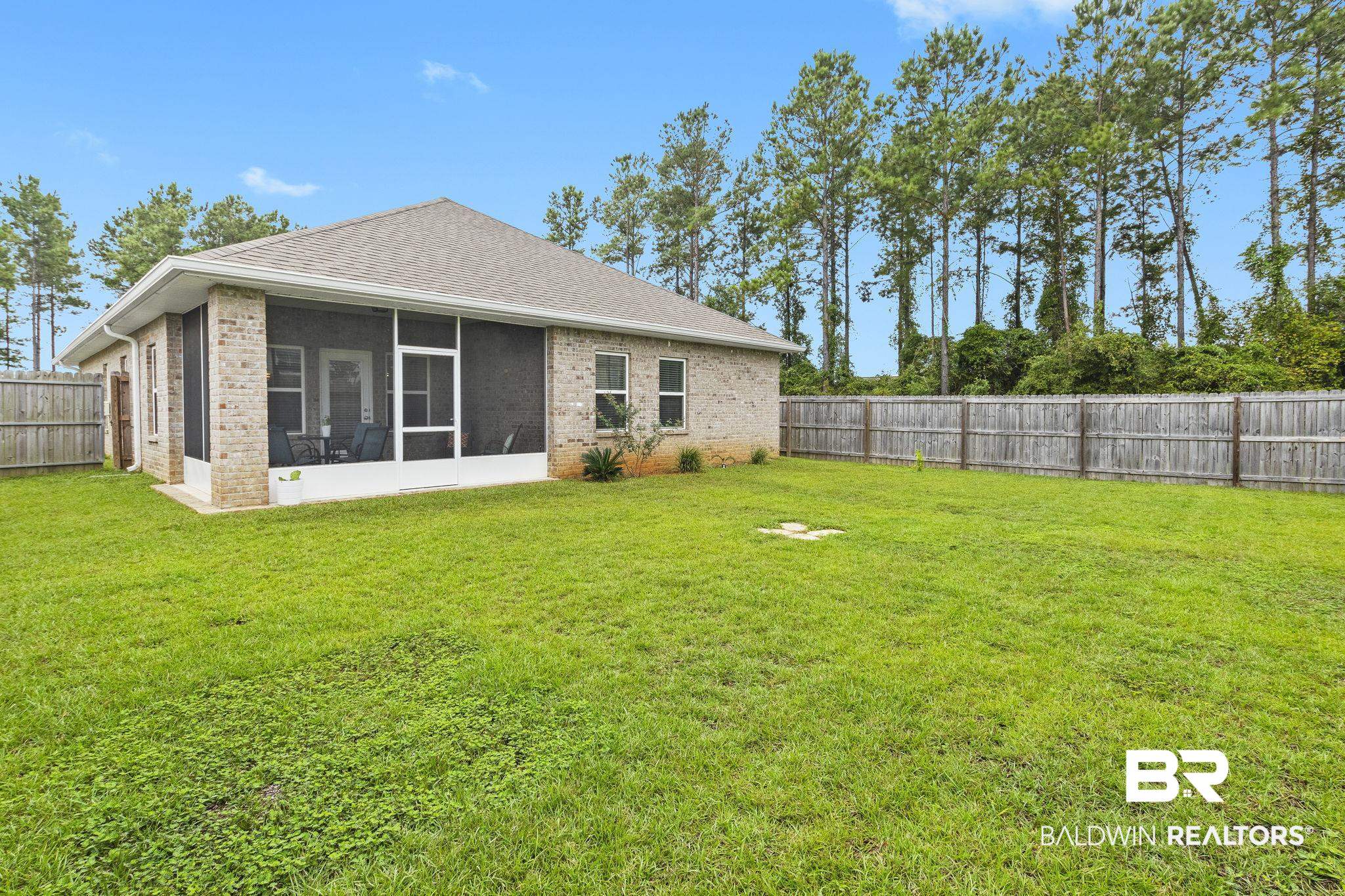 31643 Kestrel Loop Daphne, AL 36527 - Photo 38 of 59 Back of house with a lawn and a sunroom