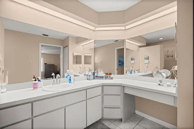 a bathroom with a sink double vanity and a mirror