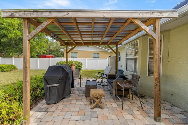 a patio with table and chairs