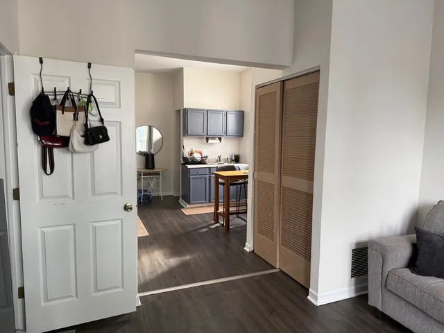 a view of a living room and kitchen