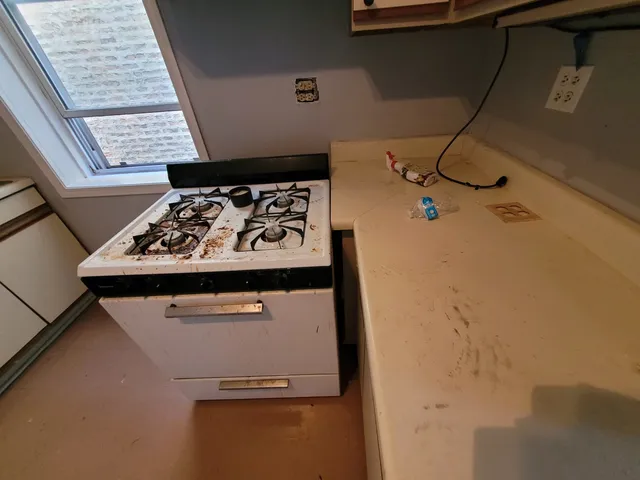 a white refrigerator freezer sitting inside of a kitchen