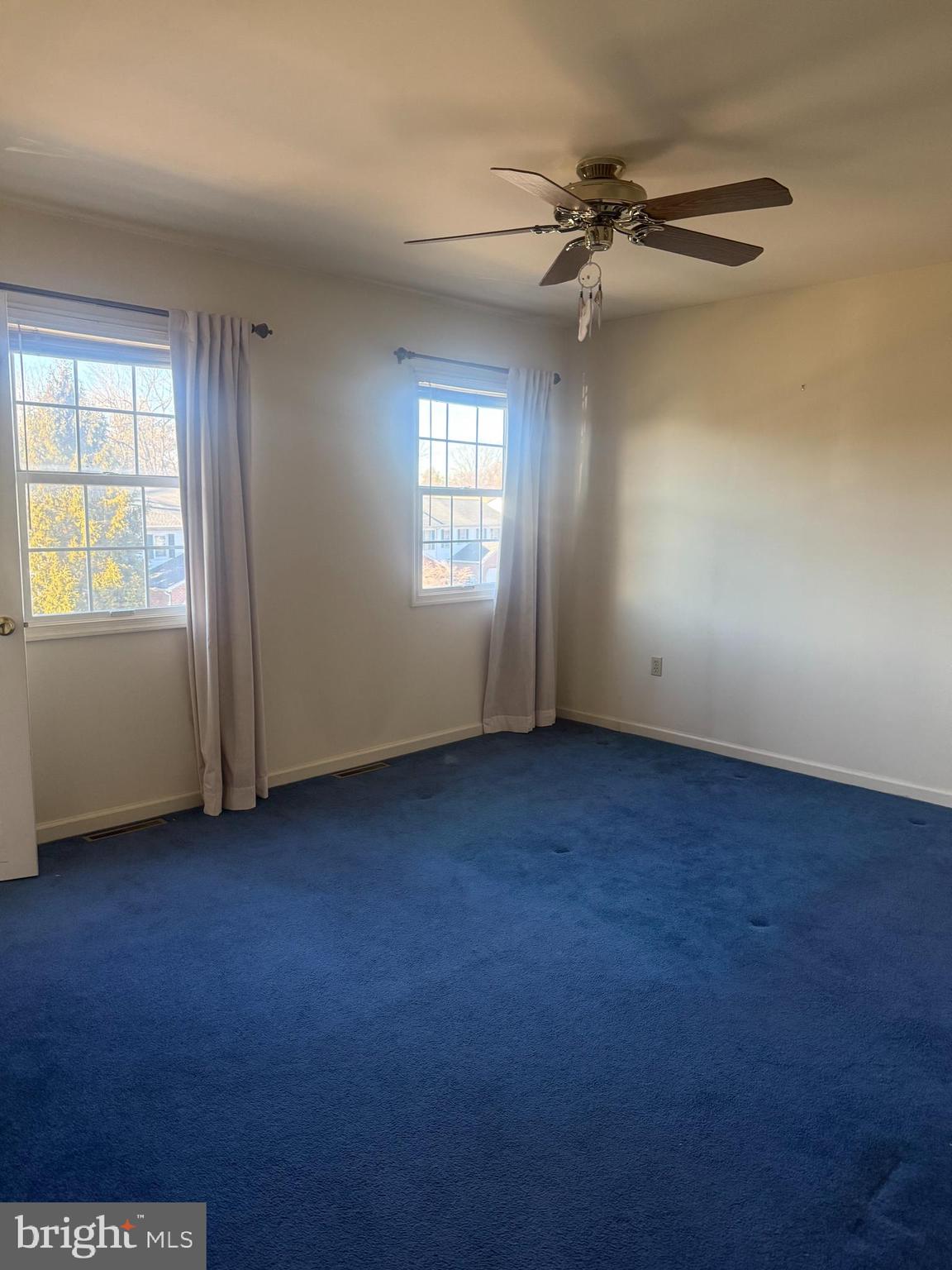 427 Crosswinds Drive Lititz, PA 17543 - Photo 3 of 6 an empty room with windows and fan