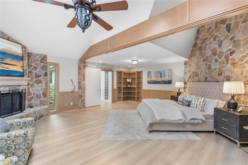 692 Private Road 5937 Emory, TX 75440 - Photo 19 of 40 a spacious bedroom with a large bed and ceiling fan