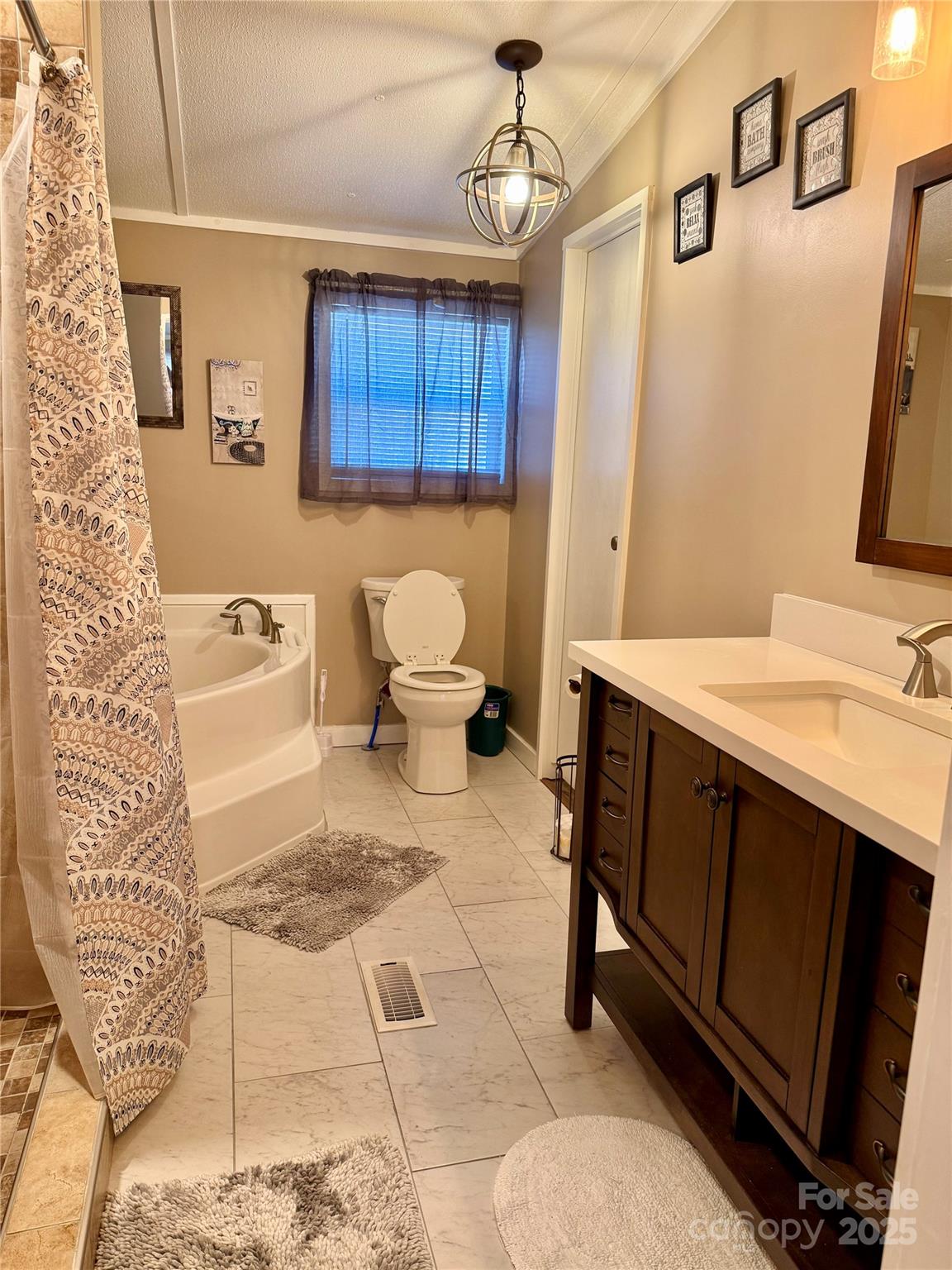 209 Romans Road China Grove, NC 28023 - Photo 14 of 25 a bathroom with a sink toilet and mirror