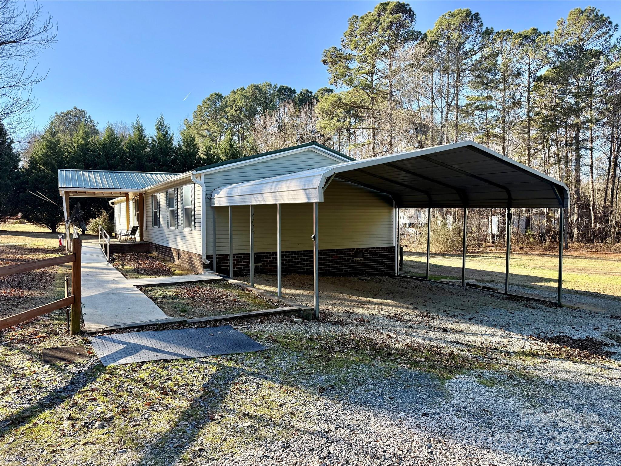 209 Romans Road China Grove, NC 28023 - Photo 2 of 25 a view of a house with backyard and sitting area