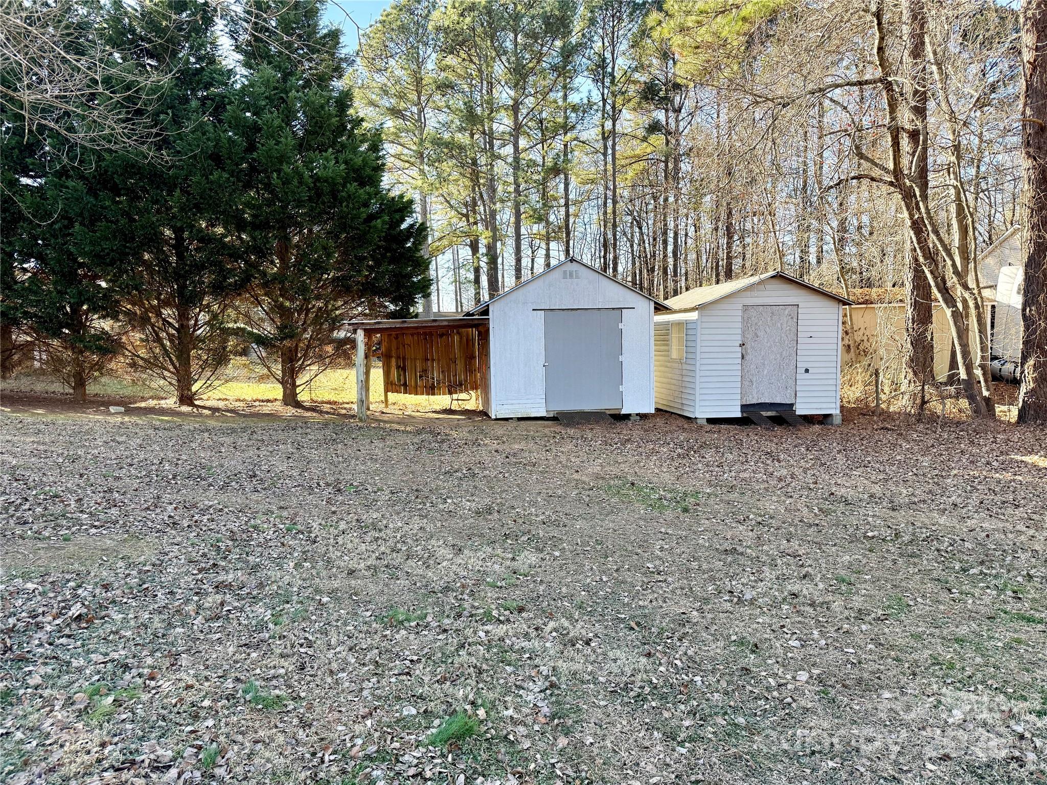 209 Romans Road China Grove, NC 28023 - Photo 24 of 25 a front view of a house with a yard and garage