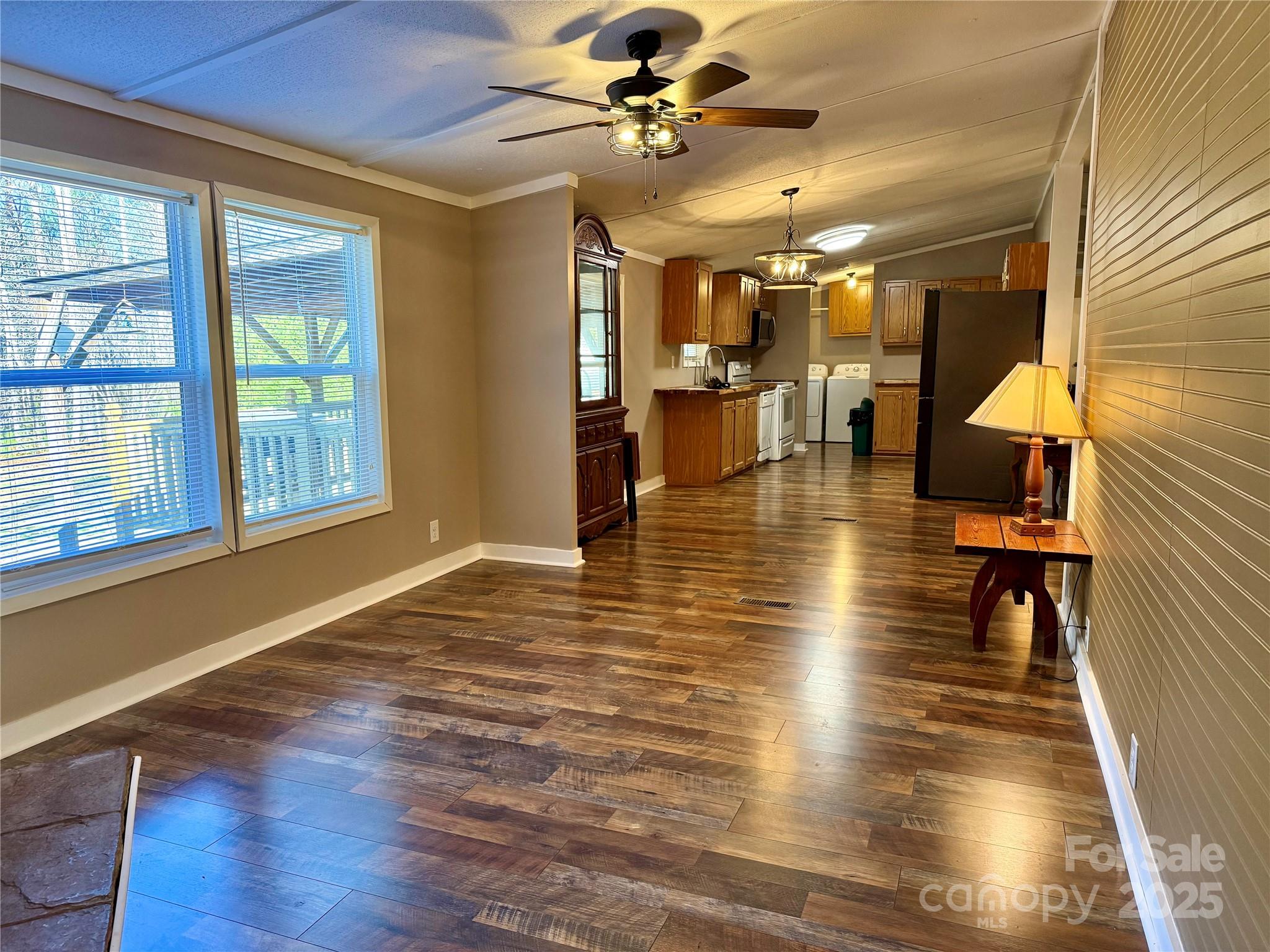 209 Romans Road China Grove, NC 28023 - Photo 6 of 25 a view of a livingroom with furniture a ceiling fan and window