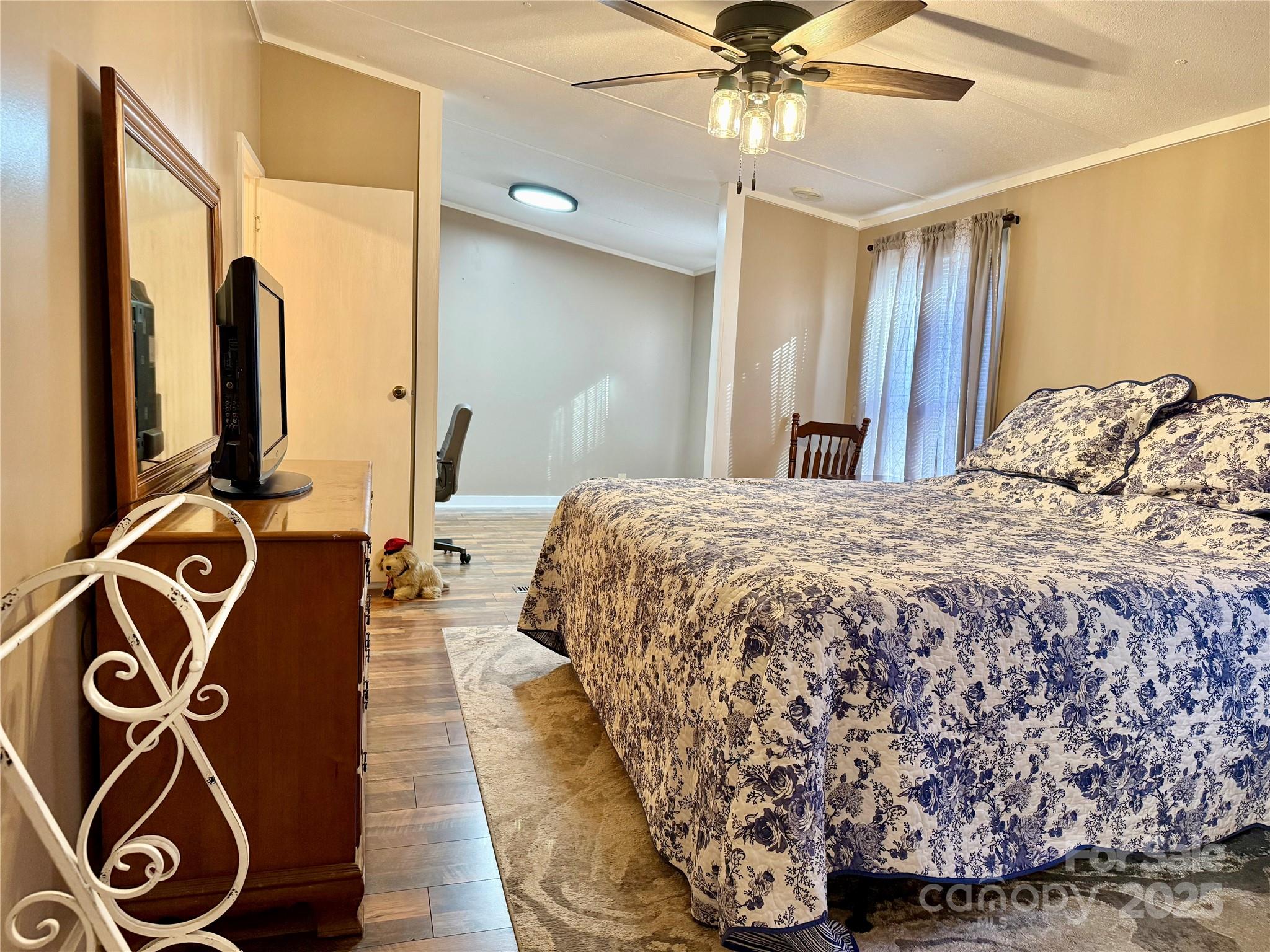 209 Romans Road China Grove, NC 28023 - Photo 10 of 25 a bedroom with a bed and ceiling fan