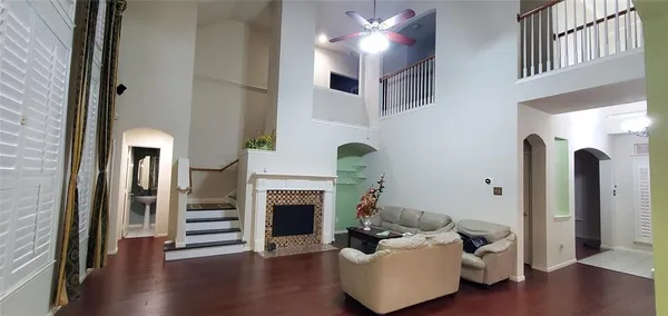 a view of a backyard with potted plants and wooden fence