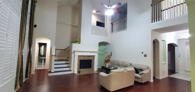 a view of a backyard with potted plants and wooden fence