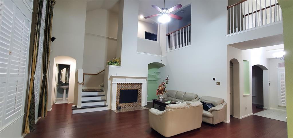 1003 Spring Tide Drive Wylie, TX 75098 - Photo 19 of 24 a living room with furniture and a fireplace