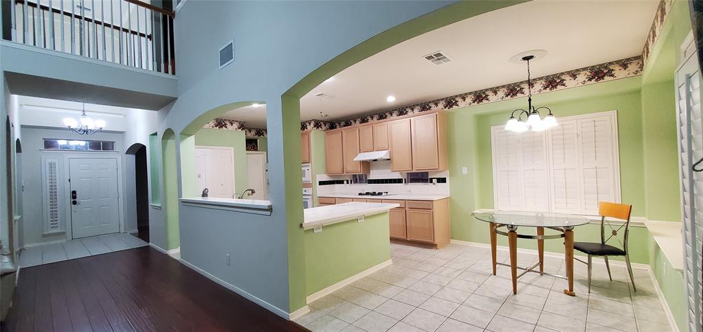 1003 Spring Tide Drive Wylie, TX 75098 - Photo 3 of 24 a kitchen with a sink cabinets and appliances