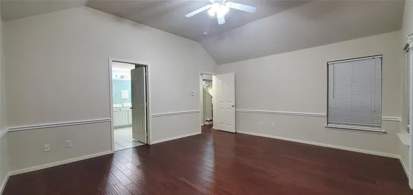 a kitchen with granite countertop a refrigerator and a stove