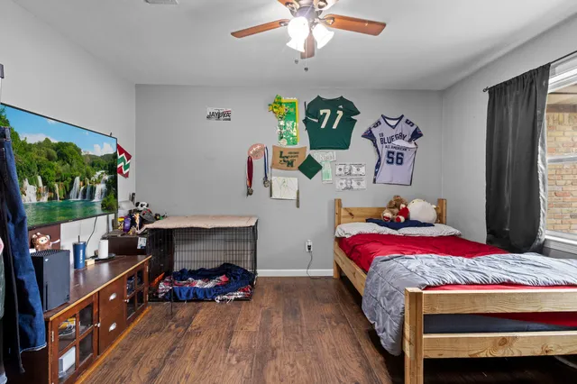 a bedroom with a bed and a fireplace