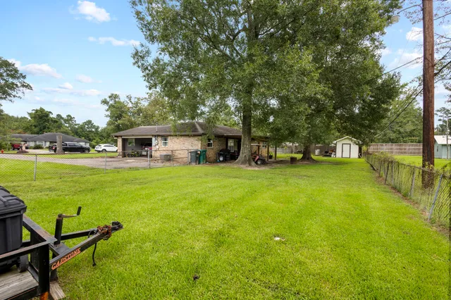 a view of a house with a yard porch and sitting area