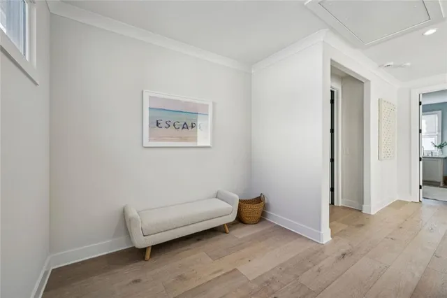 a view of a room with furniture and wooden floor